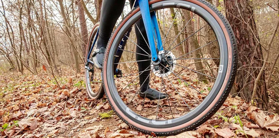 A close-up of an IDEA ROUBAIX front wheel off-road
