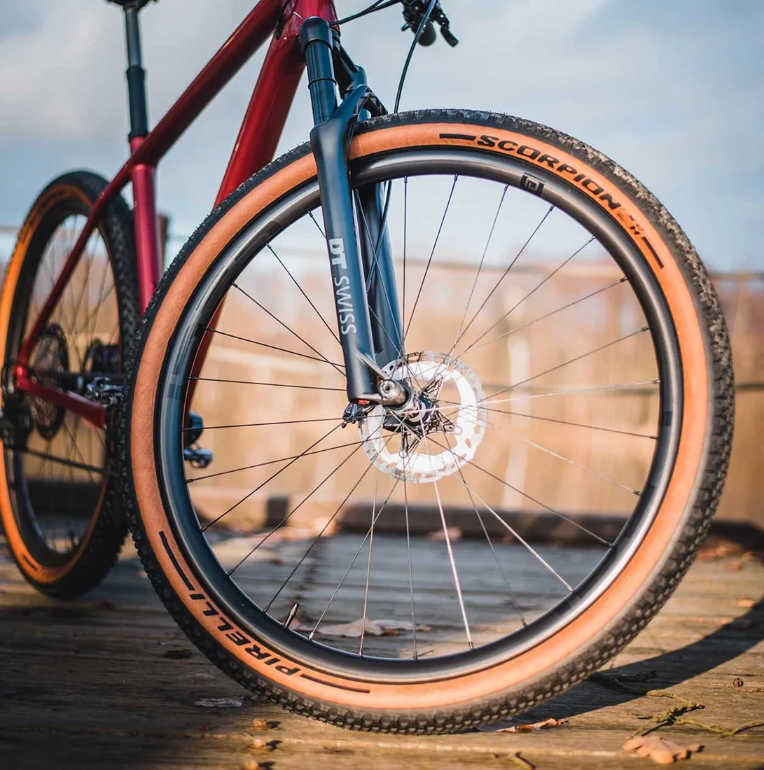 A front IDEA DOLOMITY carbon wheel on a mountain bike