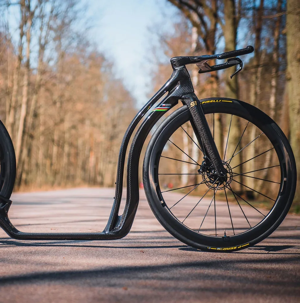 An IDEA S1 AERO carbon scooter on the road