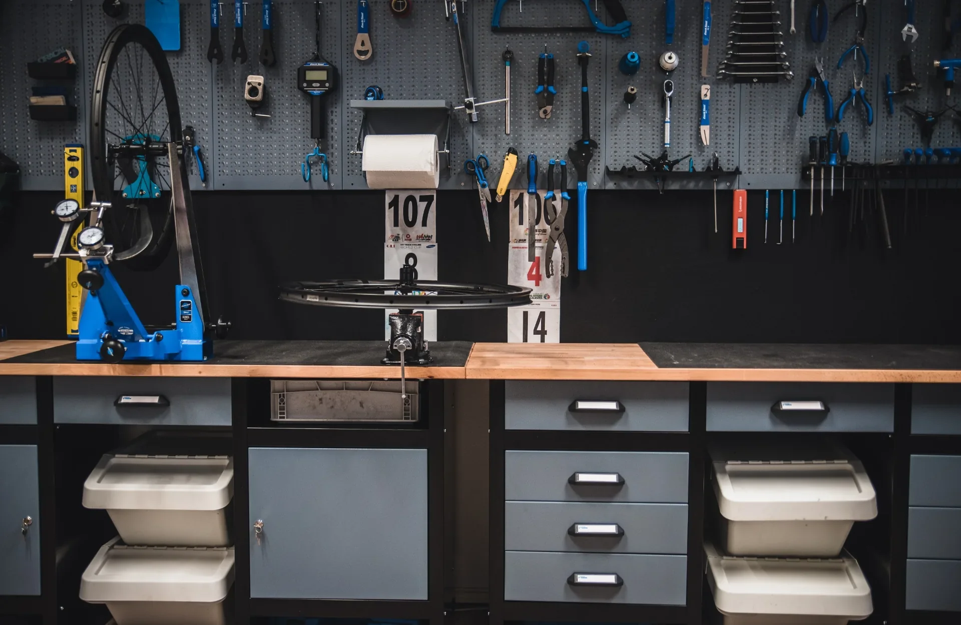 Rafkarna workshop with Park Tool equipment, a truing stand and a workbench